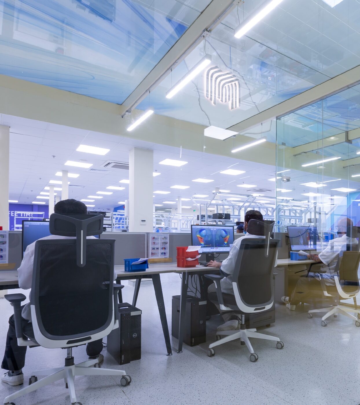 Technicians working at digital design stations